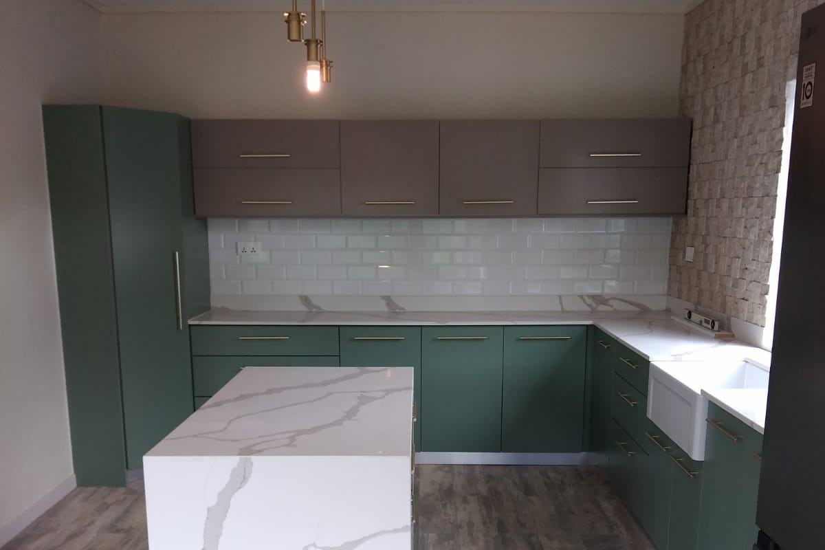 Custom green kitchen with marble island