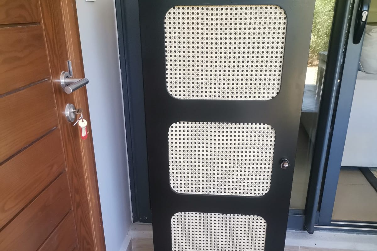 Black rattan display cabinet